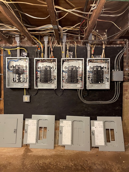After photo of upgraded commercial electrical panel with modern, organized wiring and safety equipment