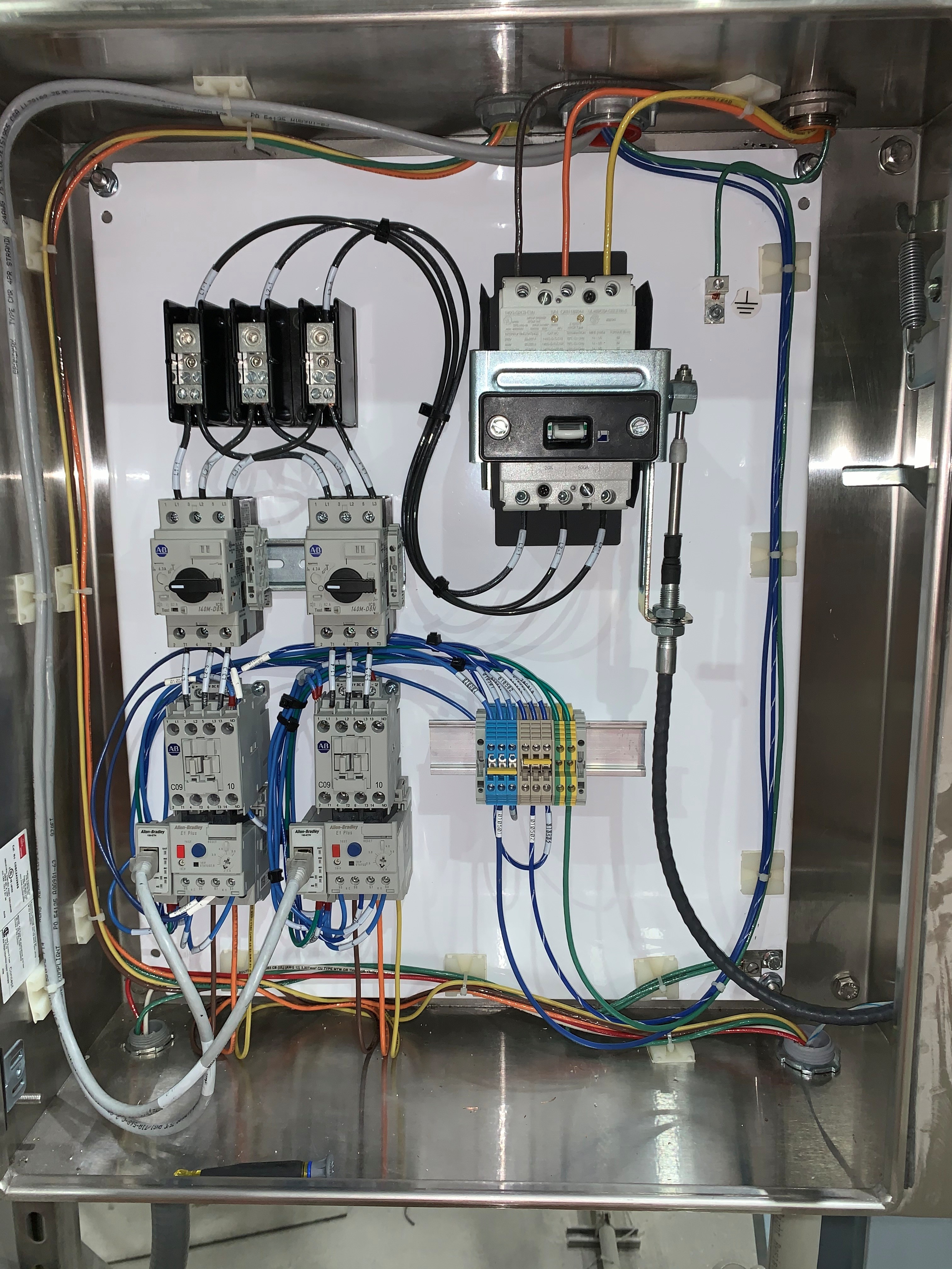 Electrical panel upgrade work showing modern breaker panel with properly labeled circuits
