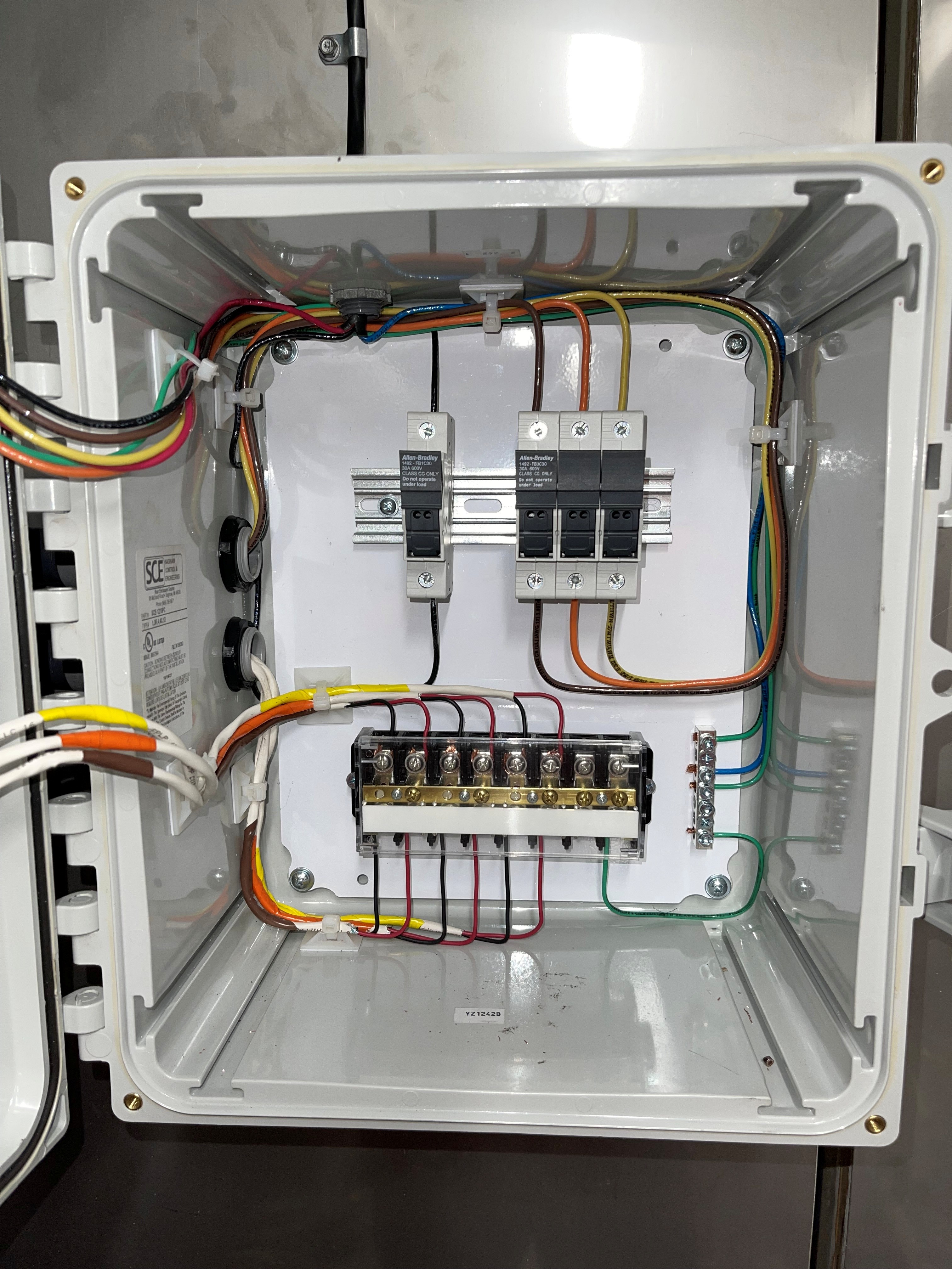 Commercial electrical panel showing organized circuit breakers and proper electrical connections