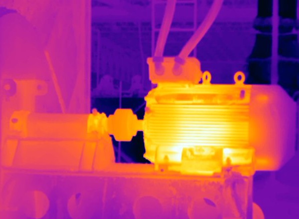 Thermal infrared image of AC motor showing heat signature indicating need for repair